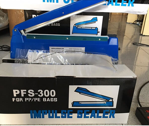 máy dán miệng túi ni long cầm tay PFS-300 .
